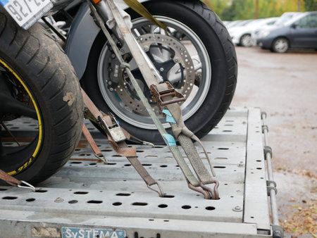 Motorcycle at a parking lot. Transportation of a motorcycle. Confiscation of transport. tethered...