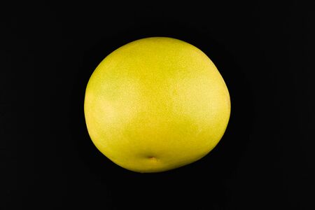 Pomelo on a black background. Place for an inscription. Easy cut. View from above. close-upの写真素材