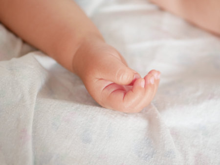 Babys hand. Close-up. A place to write. Placing text. defocusingの写真素材