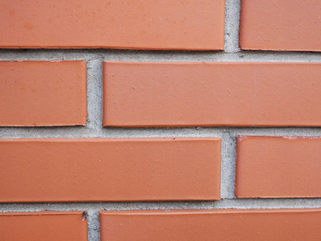 Orange brick wall. Brick with seams. Close-up. brick wall texture background, fence, brick wall,...