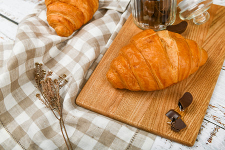 chocolate croissants. the beginning of the morning. A cup of coffee. Fresh french croissant. Coffee...