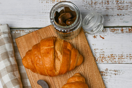french chocolate croissants top view. the beginning of the morning. Fresh french croissant. Coffee...