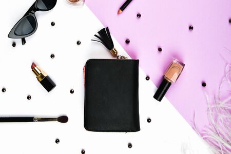 The concept of womens shopping. Basket and womens accessoris. Women's accessories, on a pink background pastel. Beauty and fashion concept. Top view, flat minimalismの写真素材