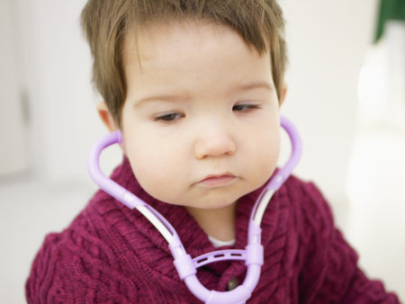 childrens and phonendoscope. Little kid boy with phonendoscope playing doctor. Healthcare and medicine concept. Toy phonendoscope.の写真素材