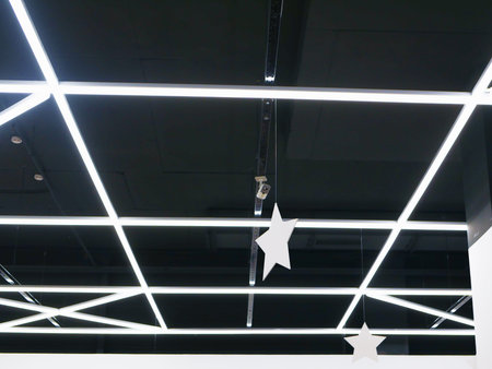 Glowing ceilings of the store. Store backlight. Element Of The Interior With The Luminaire.