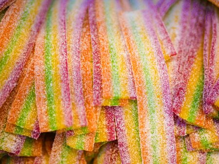 Sweets in the form of tubes. Multi-colored sweets. close-up. Children's sweets. The cause of childhood cariesの写真素材
