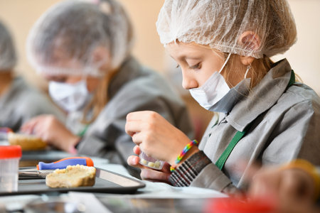 The child is studying dentistry. Training class in dentistry. children and a dentist. Teaching...