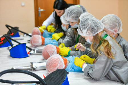Children and medicine. Interest in medicine in children. Children in medical gowns. Medical...
