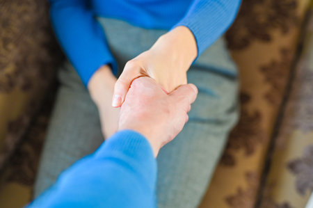 A man holds out a helping hand to a girl. close-up.