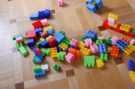 Multi-colored childrens designer. scattered across the floor