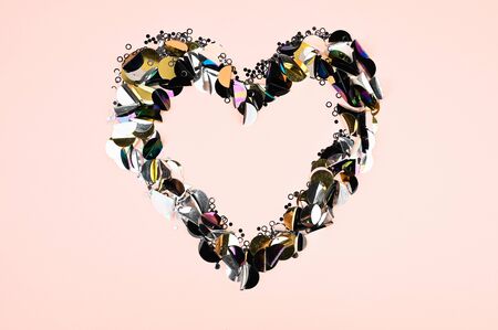Glitter heart on pink background. Valentines day, broken heart and love emergence concept. Copy space.の写真素材
