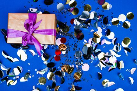 Gift black box with bow on multicolor background. Flat lay composition for birthday or wedding. 1 year conceptの写真素材