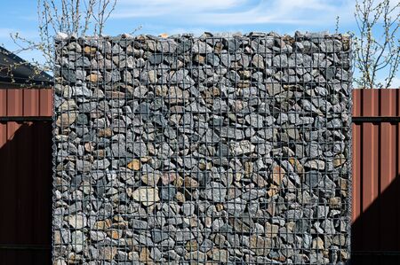 rectangular stone fence. stone building.の写真素材