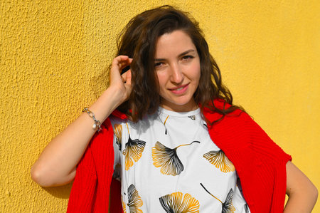 Portrait of a young girl in a red sweater