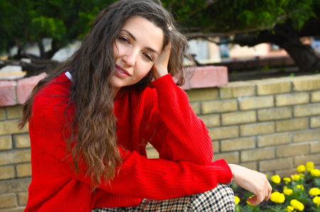 Portrait of a young girl in a red sweater