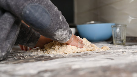 the child is studying cooking. baking and baby. High quality photo