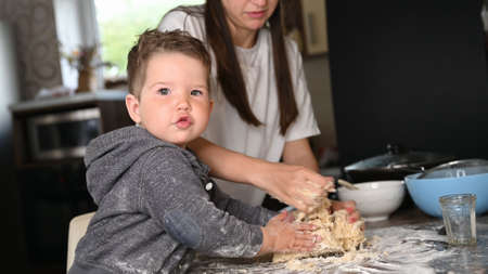 mother and child make doughの写真素材