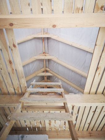 wooden staircase going to the attic