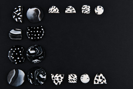 A product from polymer clay. Black and white polymer clay. Hand sculpting, product for earrings on a...