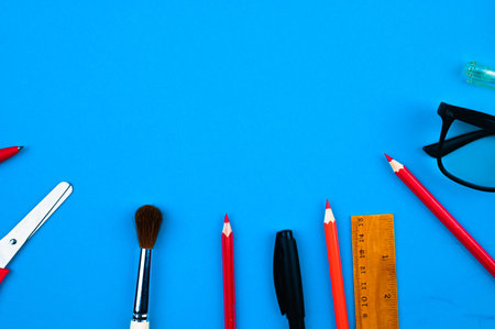 school supplies on a blue background