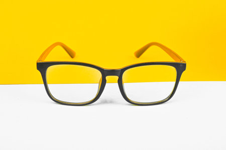 Glasses on a yellow background. front view. High quality photo