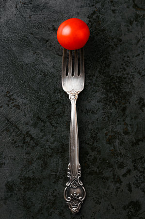 one tomato on a fork. High quality photoの写真素材