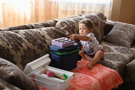 the child is interested in flasks for blood. High quality photoの写真素材