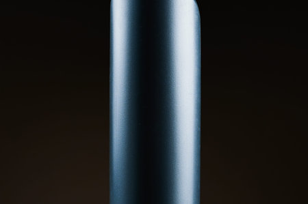 gray plastic bottle on black backgroundの写真素材