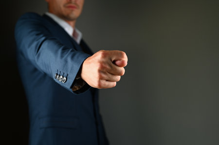 The man shows the fig a finger forward. High quality photoの写真素材