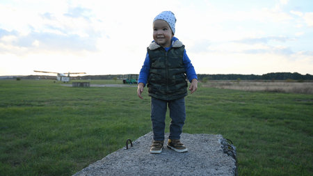 Little child learns to climb an obstacle. High quality photo