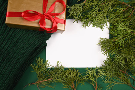 Green branches near a sheet of white paper top view. High quality photoの写真素材