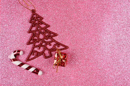 Christmas supplies on a pink glittering backdrop background. High quality photoの写真素材
