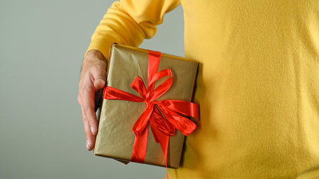 A man holding a gift box. High quality photo