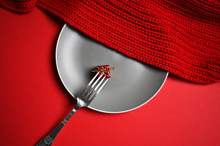 fork with a gift on a plate. High quality photoの写真素材