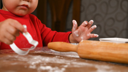 Portrait of a child in the kitchen. High quality photoの写真素材