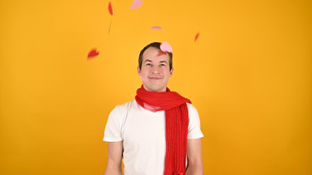 Man on the background of flying heartsの写真素材