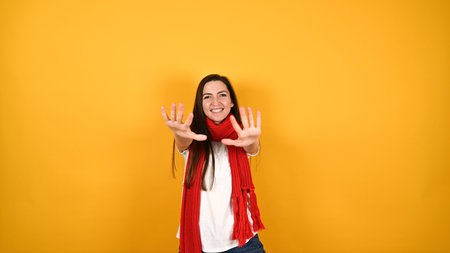Girl with a red scarf on a yellow background