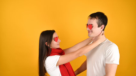 Happy man and woman kissing and hugging on yellow background. Valentine day concept. Symbol of love....