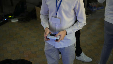 Minsk, Belarus - March 2, 2019: Playstation 5 joystick in hands. High quality photoのeditorial素材