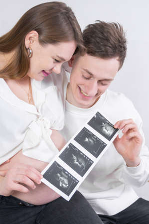 Young couple expecting their unborn child. High quality photoの写真素材