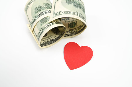 Dollars and heart, on an isolated white background. High quality photo