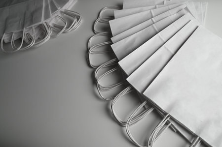 Stack of paper white bags with shadows. High quality photo
