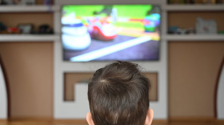 Close up of head of toddler watching tv