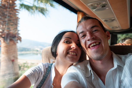 Joyful young couple going on vacation.の写真素材