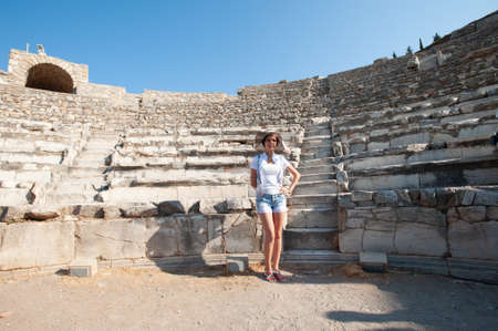 Girl tourist on the background of ancient buildings.の写真素材