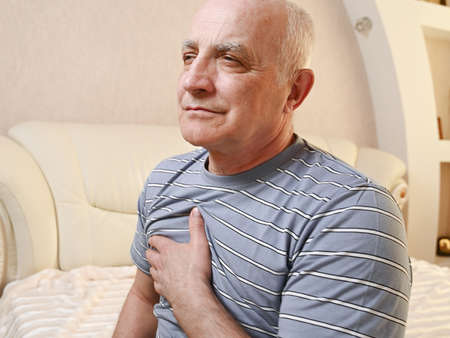 elderly man with pain in the heart.の写真素材