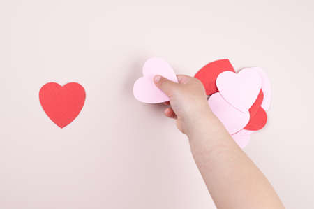 A child holding a heart in his hand.の写真素材
