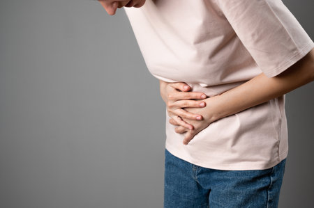 The woman has a stomach ache.の写真素材