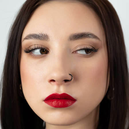Portrait of a young brunette looking sideways.の写真素材