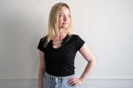 Portrait of a woman in a denim skirtの写真素材